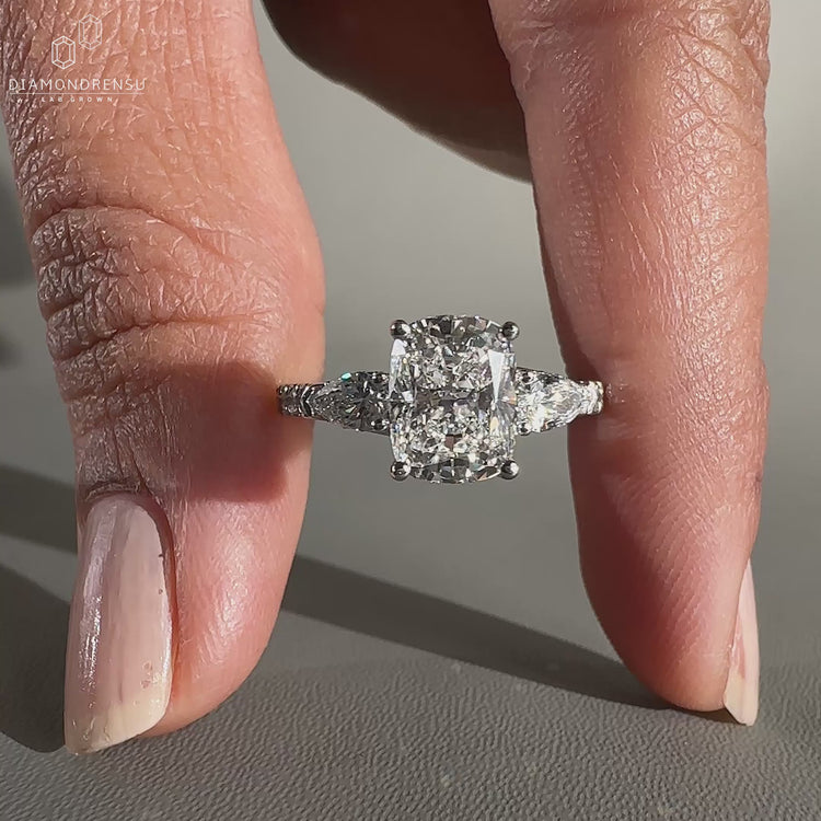 3 Stone Diamond Engagement Ring with pear side stone ring.
