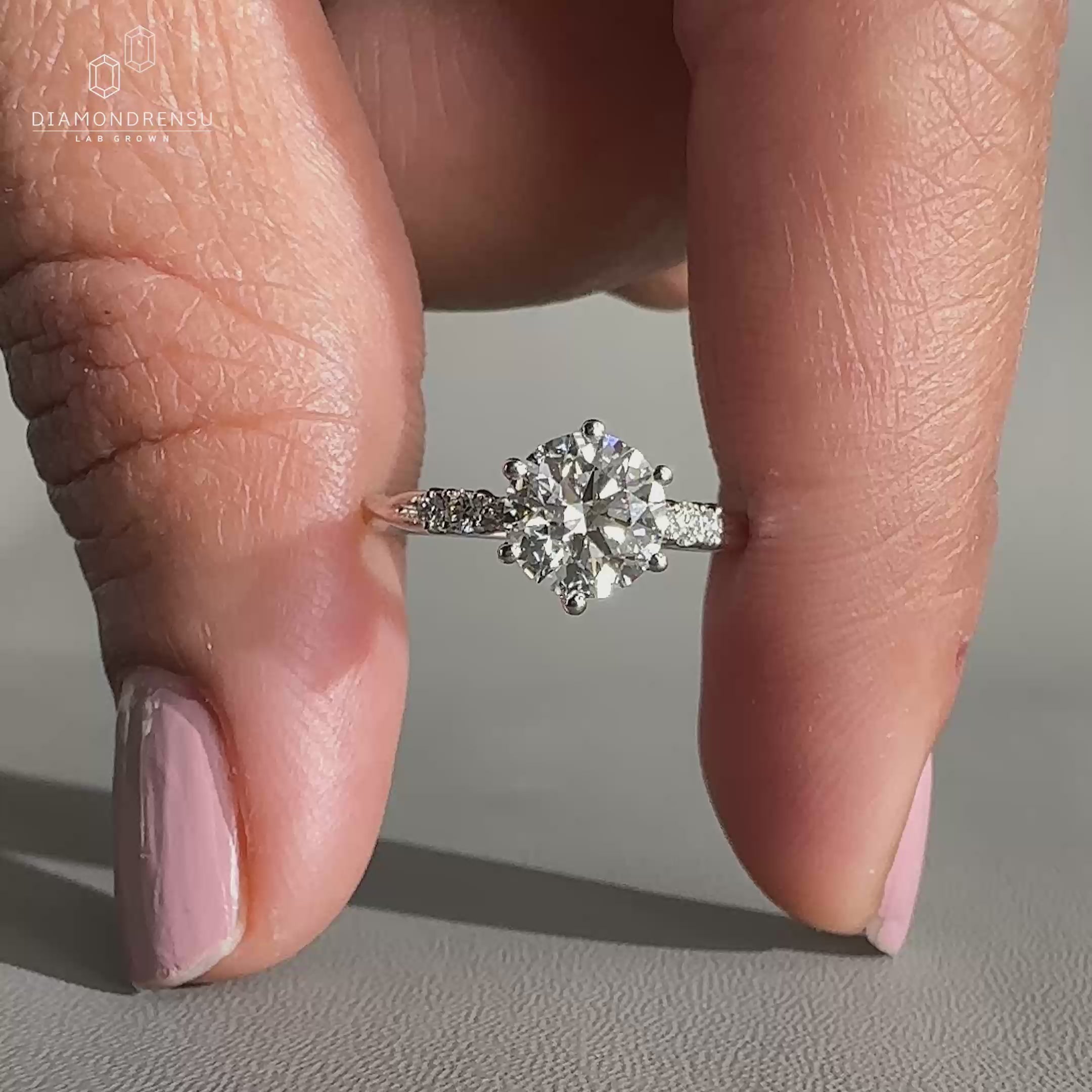 Twisted band engagement ring with round diamond

