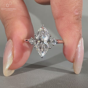 Round cut side stone with hidden halo engagement ring.
