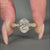 4 prong setting holds vintage engagement ring.
