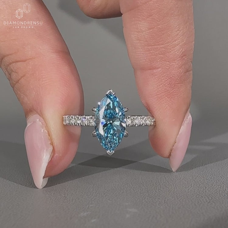 Handmade marquise diamond engagement ring with pave band.
