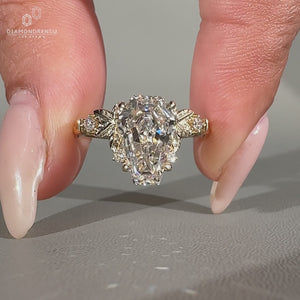 Coffin cut ring nature inspired five stone design.