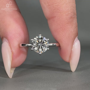 Tapered shank band with 6 prong setting.
