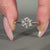 Bridge accent ring setting with tapered shank ring.
