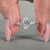 Oval and pear diamond ring with hammer finish shank.
