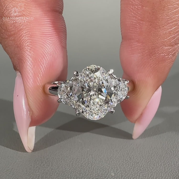 Half moon side stone ring with 4 claw prong setting.
