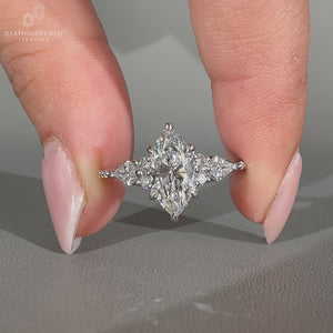 Marquise ring kite side stones tapered shank design.
