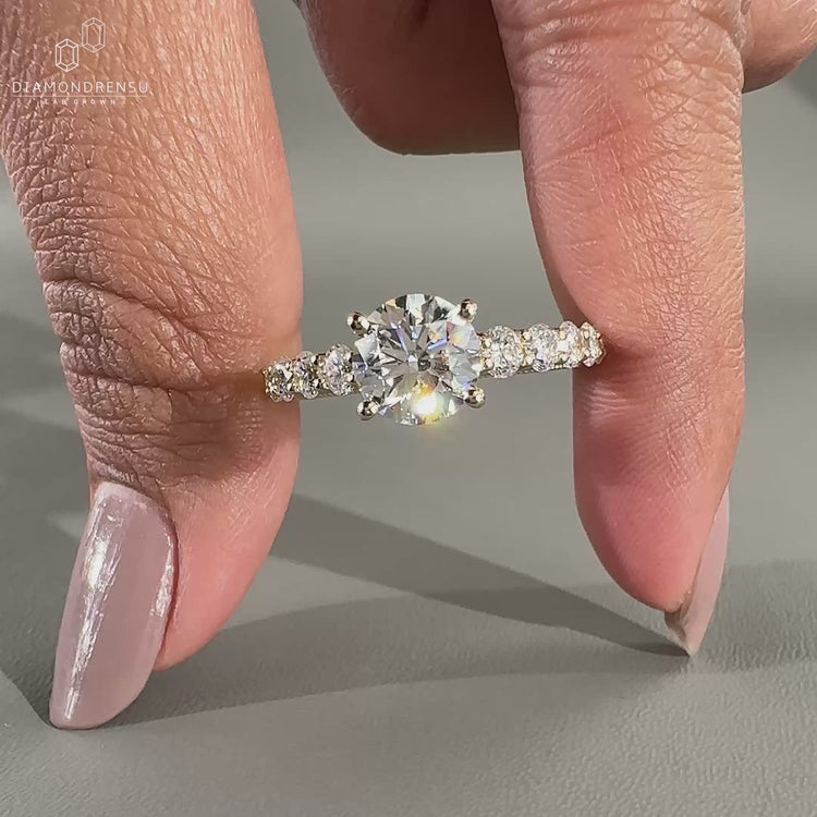 round diamond engagement ring in tapered pave set ring.
