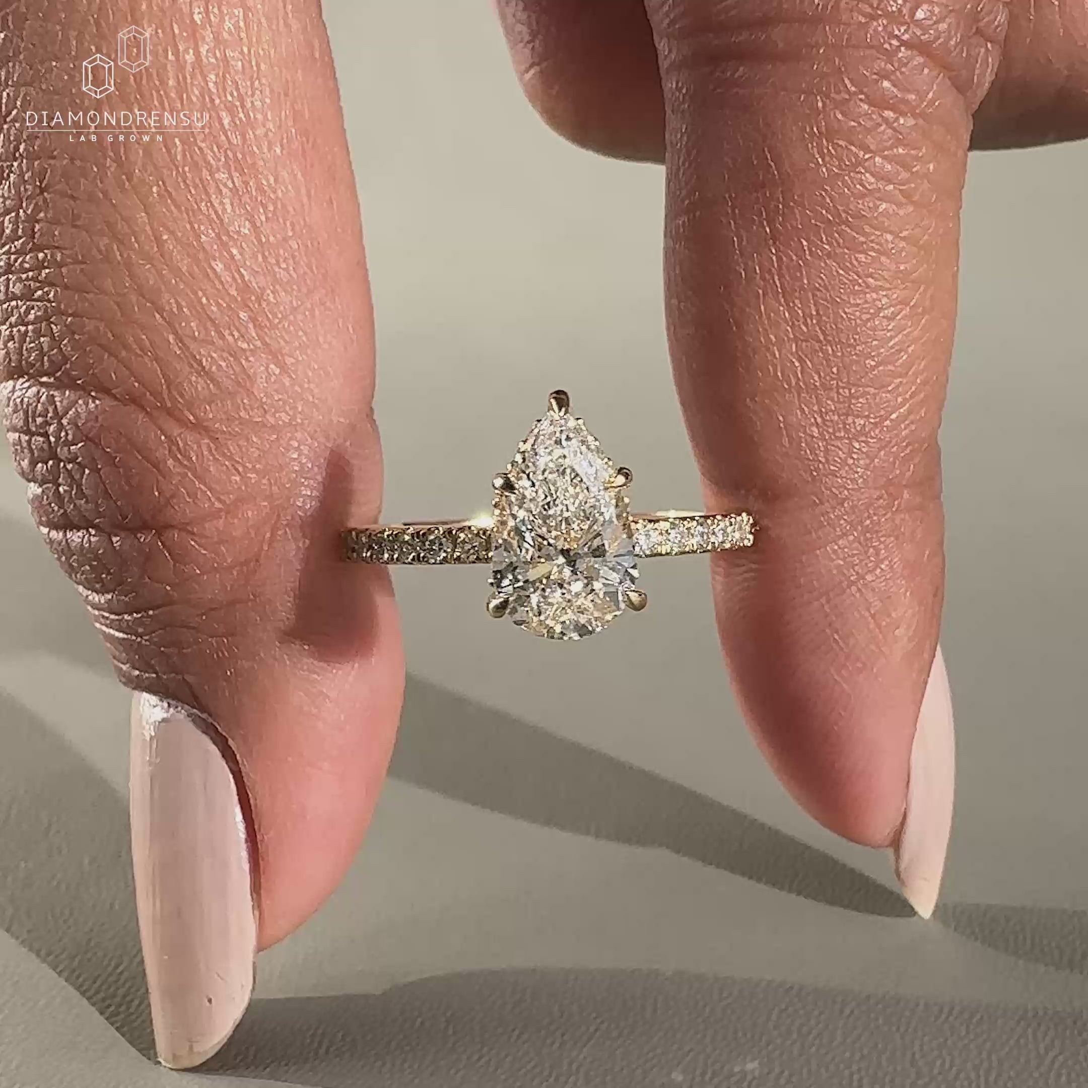 5 claw prong setting pear diamond ring in yellow gold