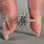 Tapered pave band in a filigree engagement ring.
