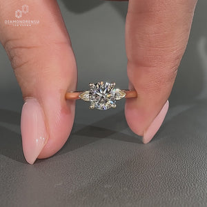 Handmade round diamond ring with cathedral setting design.