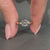 Handmade round diamond ring with cathedral setting design.