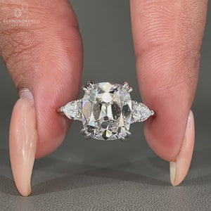 Three stone Cushion Old European Cut diamond ring.
