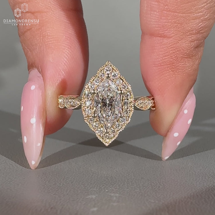 Dutch Marquise Diamond Ring with milgrain pave band.
