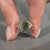 Marquise diamond ring green stone cluster leaf prong.