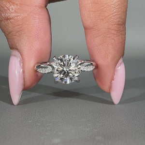 Twisted pave ring with lab grown diamonds and round diamond pave setting.