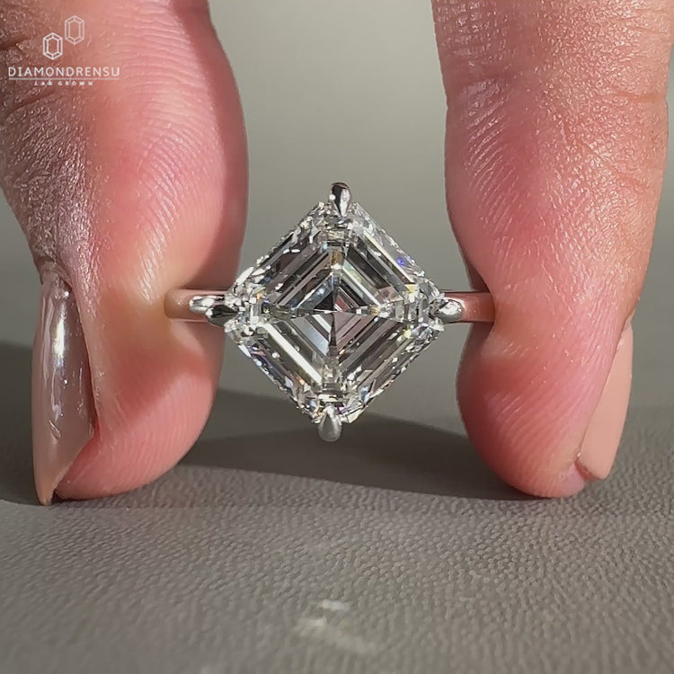 Simple engagement ring made with Asscher cut diamond ring.
