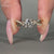 Twisted pavé engagement ring with fine detailing.
