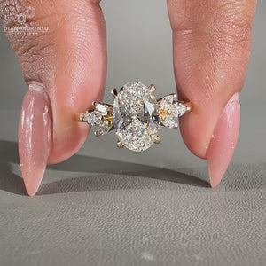 Oval cut diamond ring with hidden halo and muse setting crafted in yellow gold.
