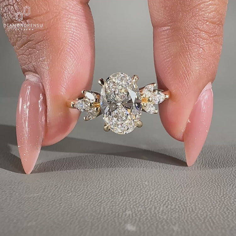 Oval cut diamond ring with hidden halo and muse setting crafted in yellow gold.
