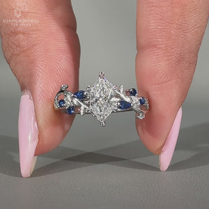 Marquise diamond ring round side stones filigree set.
