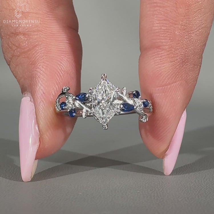 Marquise diamond ring round side stones filigree set.
