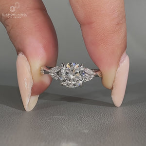 Round diamond ring cathedral claw prong setting.