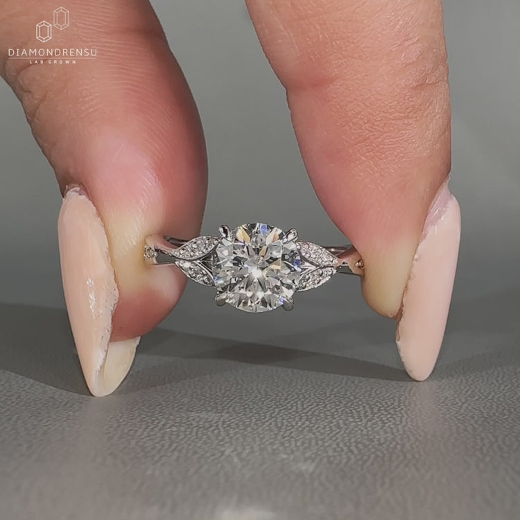 Round diamond ring cathedral claw prong setting.