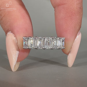 Emerald cut diamond band half eternity six stone style.

