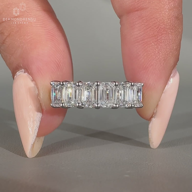 Emerald cut diamond band half eternity six stone style.
