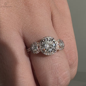 3 stone halo setting with pavé detail for extra brilliance.
