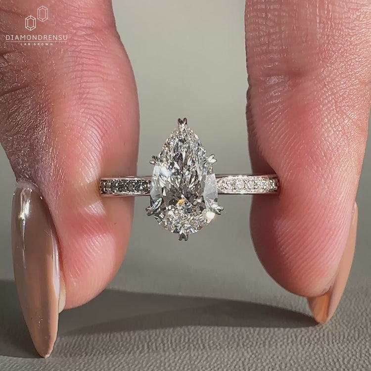 tapered pave band on white gold engagement ring.
