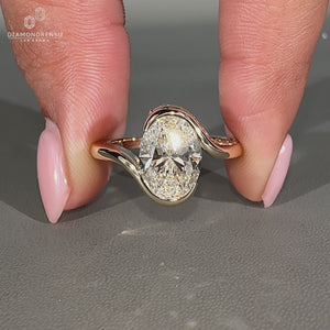 Oval diamond ring hidden pave round diamond bypass.