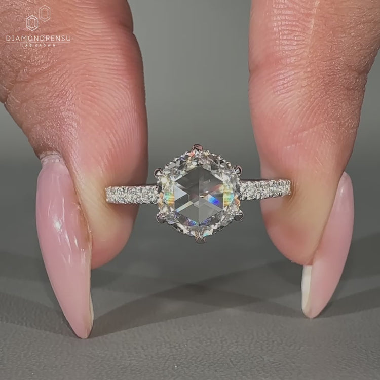 Round rose cut diamond ring with hidden halo and pavé setting.
