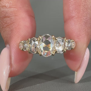 Pear diamond ring with shared prong setting.
