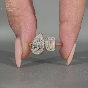Pear emerald diamond ring two stone cathedral style.
