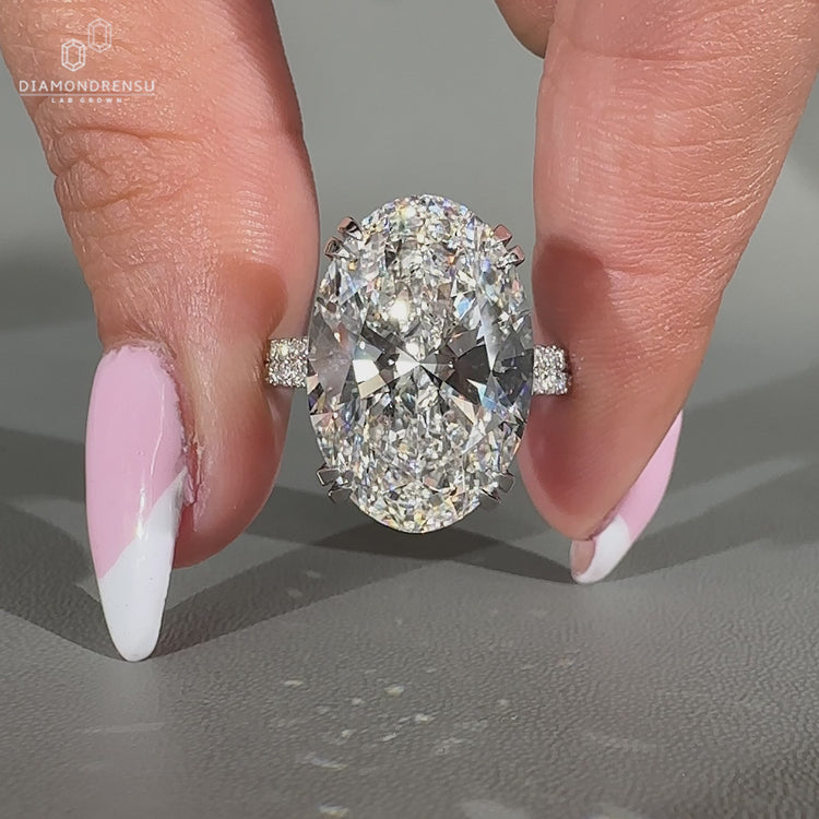 Custom oval diamond engagement ring with double row pave.