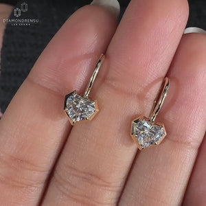 Heart shape diamond earrings with claw prong setting.
