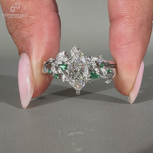 Dutch marquise ring with round and marquise side stones.