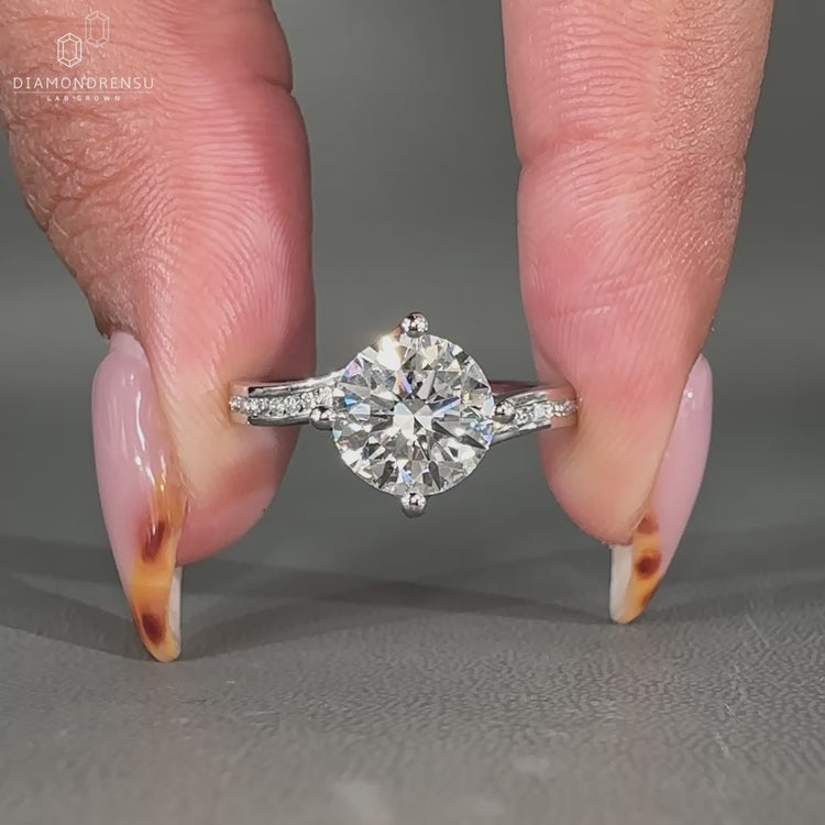 Compass prong setting used in channel set diamond ring.
