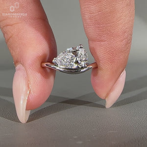 Handmade pear diamond ring with V prong setting.
