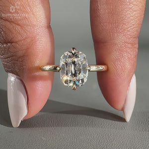 Hidden halo ring featuring old mine cut diamond center.
