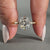 Hidden halo ring featuring old mine cut diamond center.
