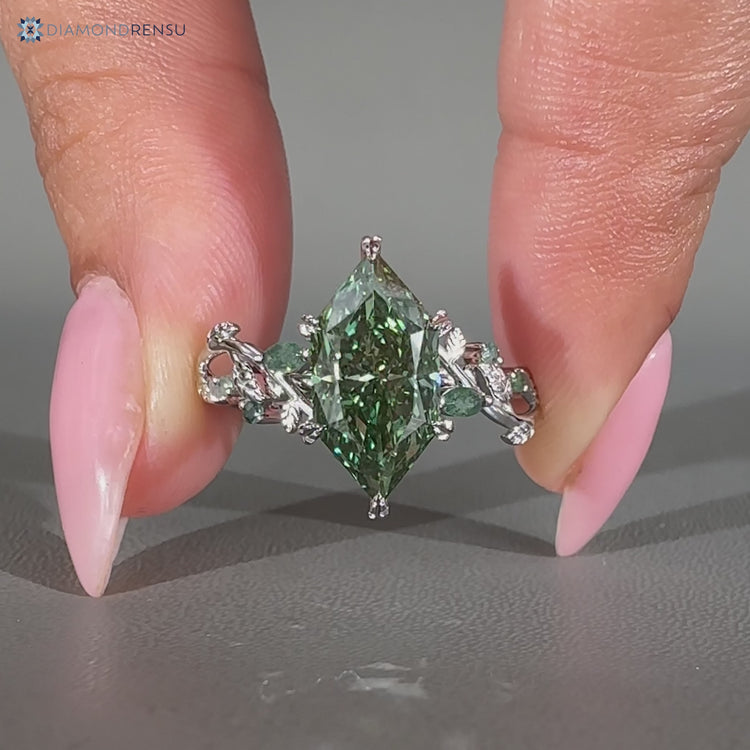 Nature inspired marquise ring with moss agate side stones.