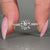 Round diamond ring with tulip basket setting.