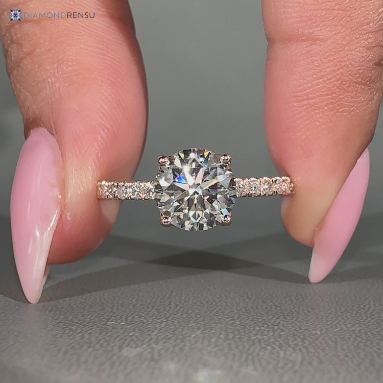 Round diamond ring with tulip basket setting.