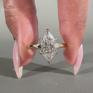 Dutch marquise cut solitaire diamond ring in yellow gold.
