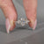 Oval diamond ring marquise round stones tapered shank.
