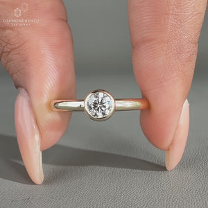 Minimalist bezel set solitaire engagement ring by Diamondrensu AU.
