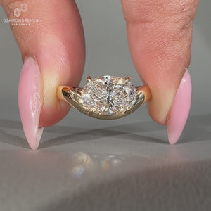 Oval lab created diamond engagement ring with curved wave shank